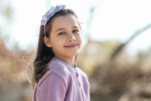 Portrait Of Beautiful Child Girl Outdoors In Spring Season
