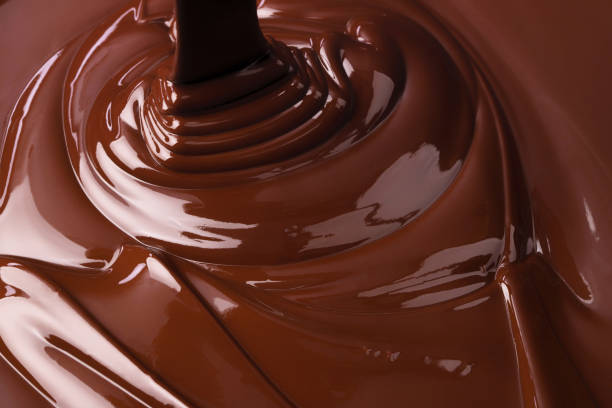 istock melted dark chocolate background. pouring liquid cocoa dessert 1312410235