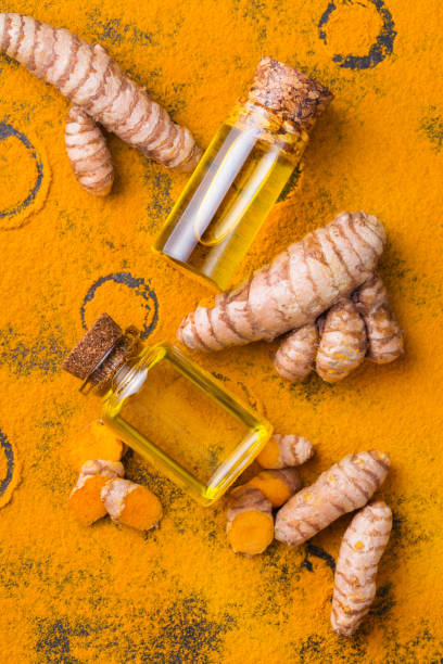 istock Turmeric essential oil, orange root and powder, beauty and spa 1312411280