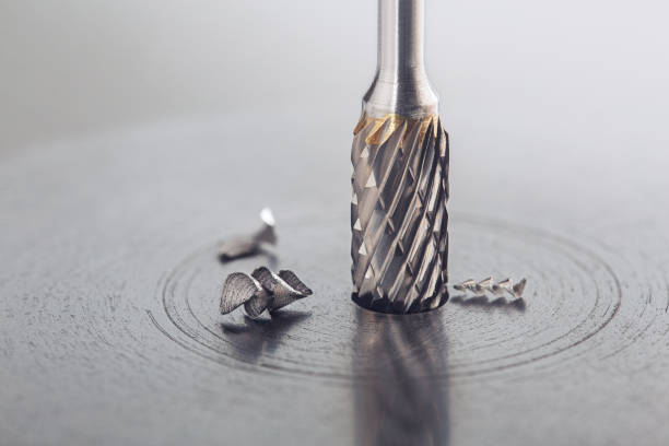istock Milling cutter make sink in hole in steel billet. Locksmith work. 1312411897