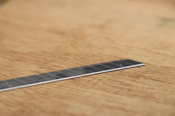 istock Hobby knife blade spare part on wooden background 1312411963