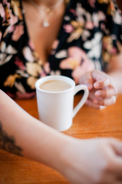 istock Woman Pouring Coffee at Diner 1312413407