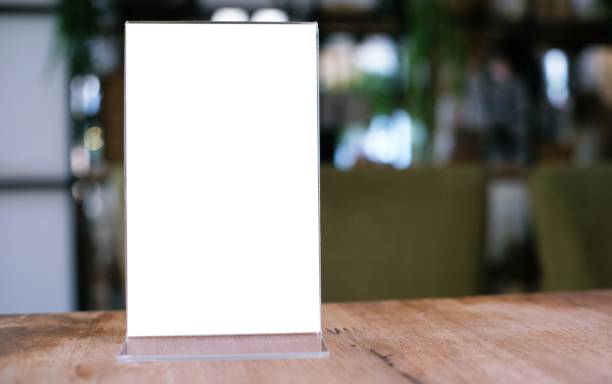 istock Menu frame standing on wood table in Bar restaurant cafe. space for text marketing promotion. 1312415918