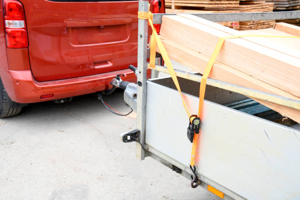 Trailer strop or strap in orange nylon and metal, object helping for holding stuff , storage and transport for safty and security. stock photo