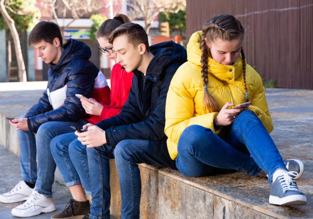 istock Teenagers chatting on their smartphone on walking 1312416469