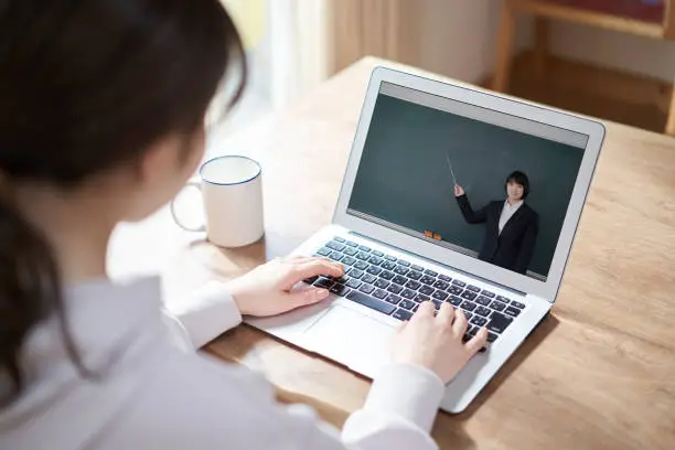 Asian women taking online lessons