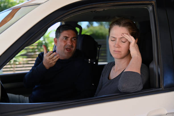 Couple having an argument in a car Adult couple (male and female age 30-40) having an argument in a car. israeli ethnicity stock pictures, royalty-free photos & images