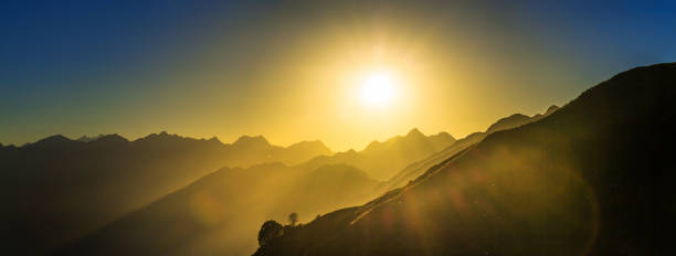 istock anorama landscape with sunrise over mountains 1312421815