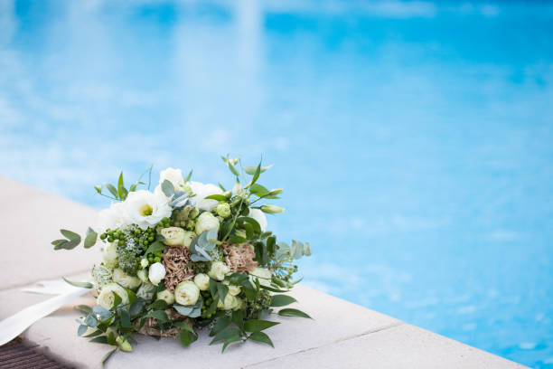 istock Wedding bridal bouquet on a blue background close-up 1312421873