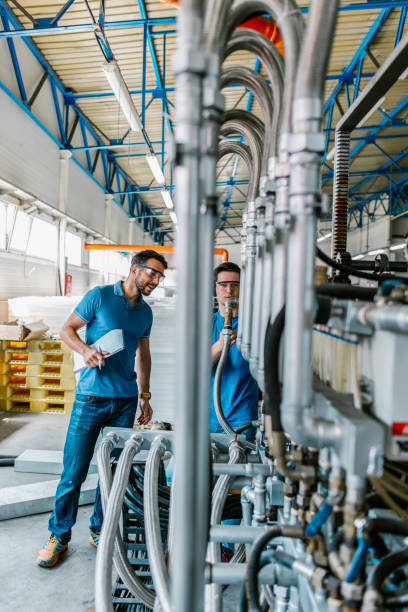 istock People at work. Industrial manufacture indoors. 1312422972
