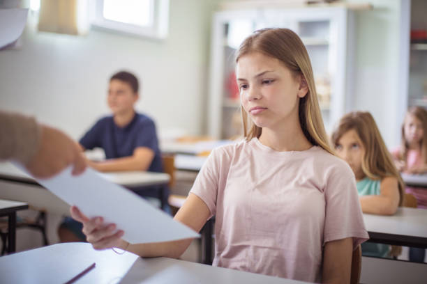istock Teens in class. The teacher gives them control tasks. 1312423221