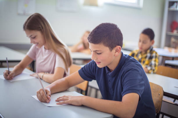 istock Teenagers students sitting in the classroom. 1312425464