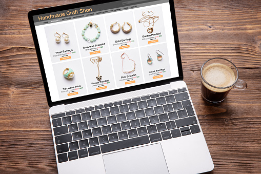 Online shop website for handmade jewelry displayed on laptop computer