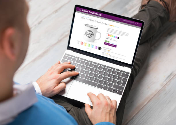 istock Man creating his own products by using print on demand service online 1312425820