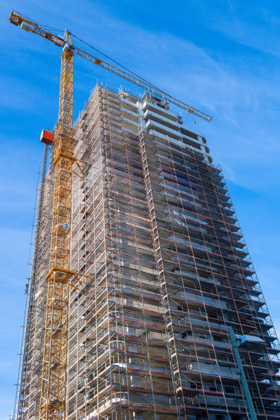 istock construction site in berlin with skyscraper, cranes an blue sky 1312426353