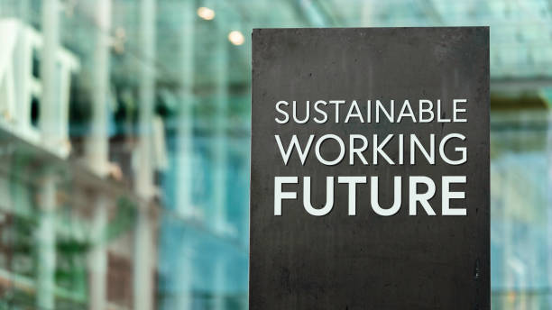 istock Sustainable Working Future sign in front of a modern office building 1312427208