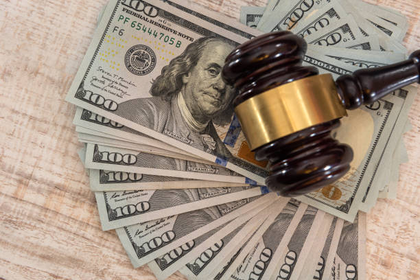 istock dollar money and judges gavel on table 1312427279