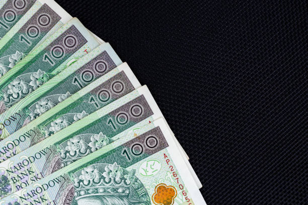 istock Polish banknotes of PLN 100 on a black background. 1312430551