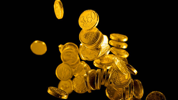 Gold foil wrapped chocolate euro coins falling