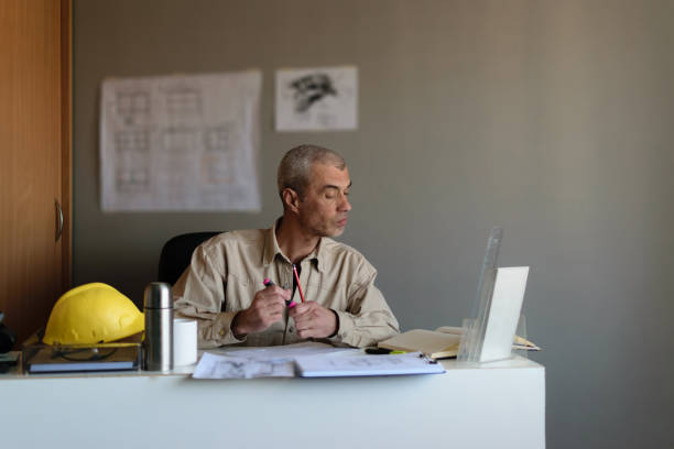 istock The engineer works in his office, trying to find a solution for future jobs. 1312433161