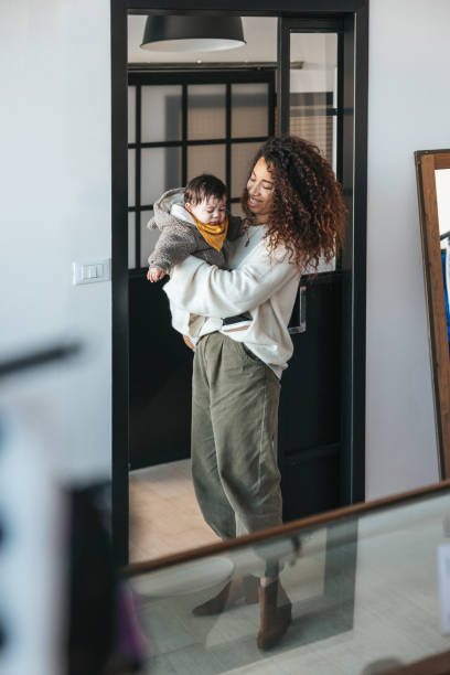 istock Young mother in the office with her baby 1312433559