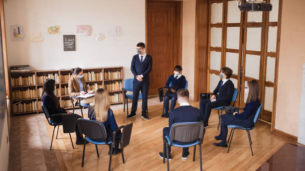 istock Group psychotherapy in High school during covid - 19 pandemic 1312433850