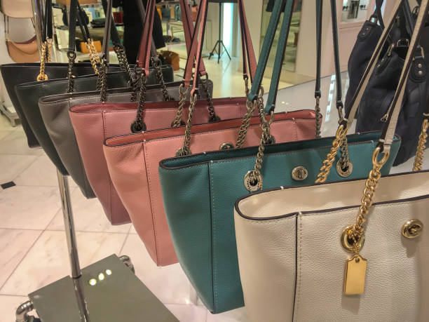 istock Colorful Shoulder Bags Hanging On the Display Rack 1312436501