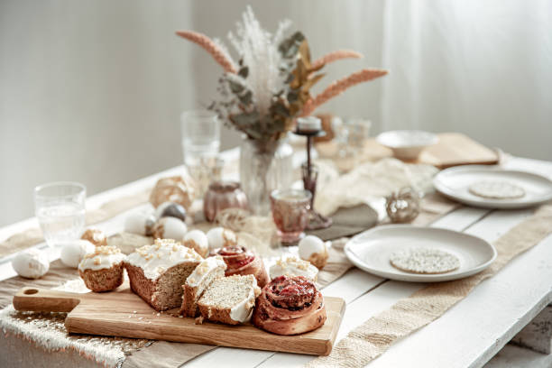 istock Easter table setting with decor details and homemade cakes. 1312436991