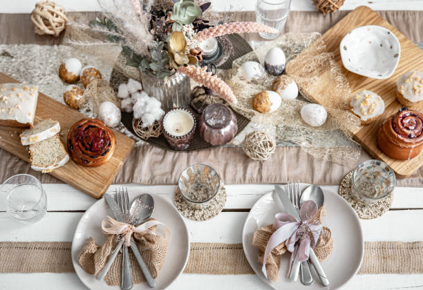 istock Easter table setting with decor details and homemade cakes top view. 1312436999