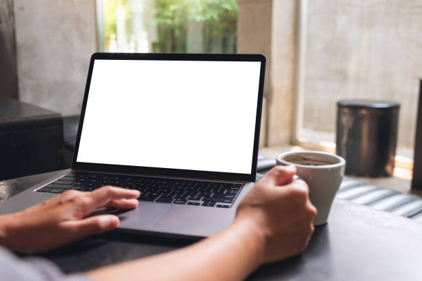 istock a woman using and touching on laptop touchpad with blank white desktop screen while drinking coffee 1312439713