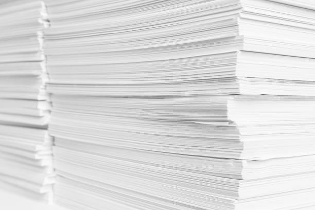 istock Stacks of white paper sheets, closeup view 1312439769