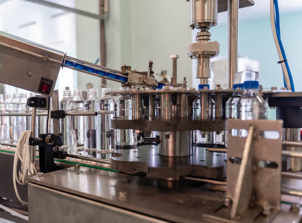 istock The process of twisting the lids on plastic bottles. Water production. 1312441689