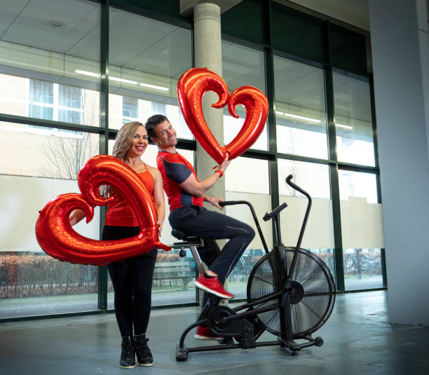 istock personal trainers in gym, valentine theme 1312443022