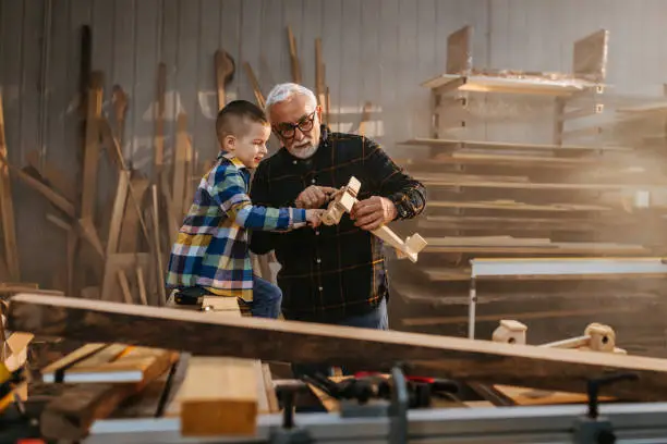 Photo of Grandfather made a wooden plane for his grandson