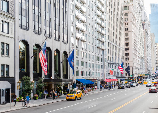 New York City, United States - August 25, 2008: W 59th Street with Park Lane Hotel, buildinga facade, and traffic.