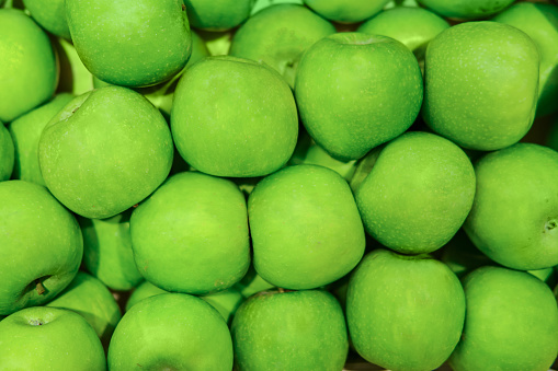 Food background green apples, fruits close-up