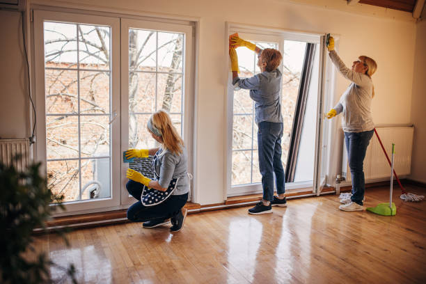 istock Women cleaning windows 1312449865