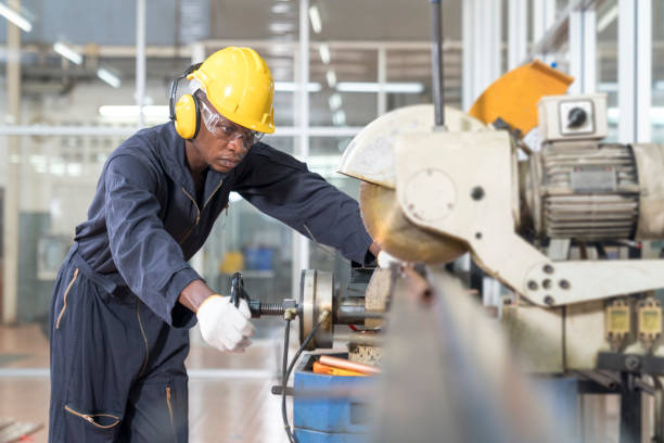 istock Engineer in a factory . Smart factory worker or engineer using machine job in a manufacturing workshop 1312449882