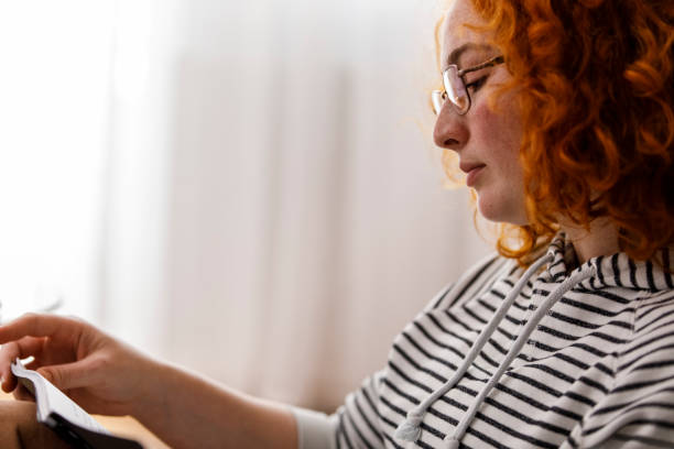 istock Copy space shot of young woman reading her notes and studying for a test 1312450914