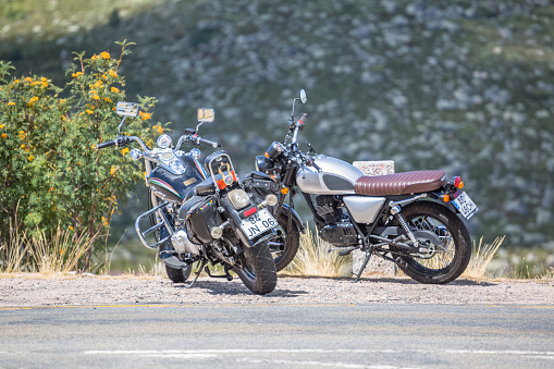 Seia / Serra da Estrela / Portugal - 08 15 2020: View of two large displacement motorcycles parked at the side of the road