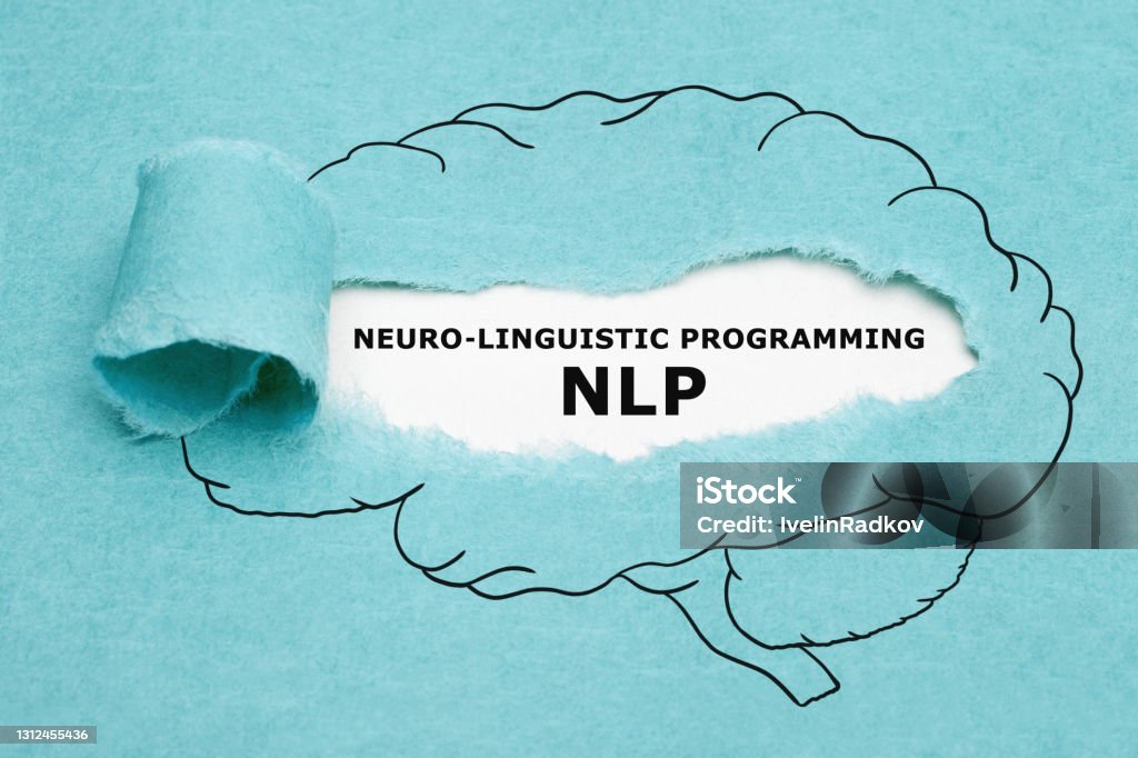 NLP Neuro Linguistic Programming Concept Printed acronym NLP Neuro Linguistic Programming appearing behind torn blue paper in human brain drawing. Linguistics Stock Photo