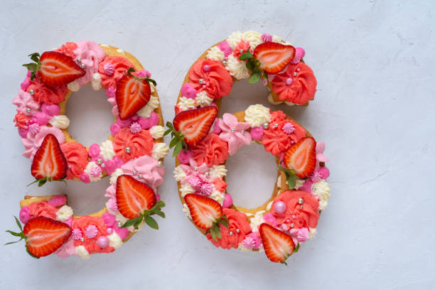 istock Birthday cake. Unusual modern design with strawberries. Spring time. Postcard for the holiday. Congratulations are bright and creative. Beautiful cake in the shape of number 96 1312456294