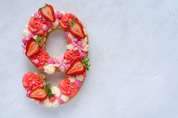 Birthday cake. Unusual modern design with strawberries. Spring time. Postcard for the holiday. Congratulations are bright and creative. Beautiful cake in the shape of number 9