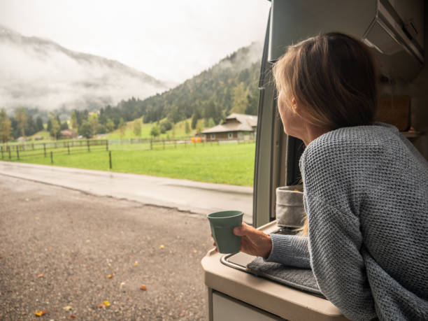 istock Woman enjoys coffee from her van 1312456659