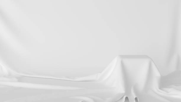 istock 3D Scene. Product display stand covered with white cloth. 1312457483