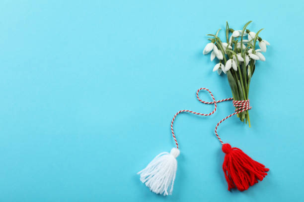 Martisor with snowdrop flowers celebrating the arrival of spring on snow
