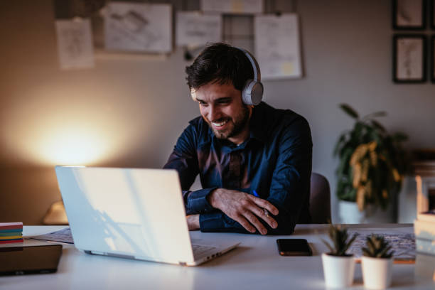 istock Man having video call on laptop 1312458973