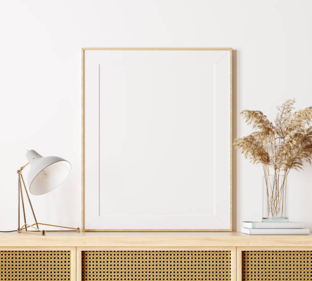 istock Modern interior design in natural colors with dry plants decoration and empty white mock up picture frame 1312459389
