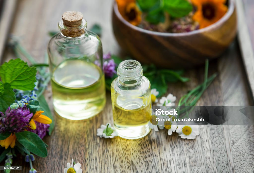 Herbal Aromatherapy Oils With Medicinal Plants And Herbs Essential Oils  Bottles Stock Photo - Download Image Now - iStock