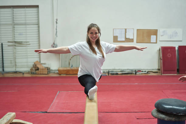 istock Proud female gymnast, cant hide her excitment after she successfully performed the split on the balance beam 1312462109